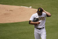 San Diego Padres starting pitcher Dinelson Lamet walks towards the dugout after the third out during the first inning of a baseball game against the Milwaukee Brewers, Wednesday, April 21, 2021, in San Diego. (AP Photo/Gregory Bull)