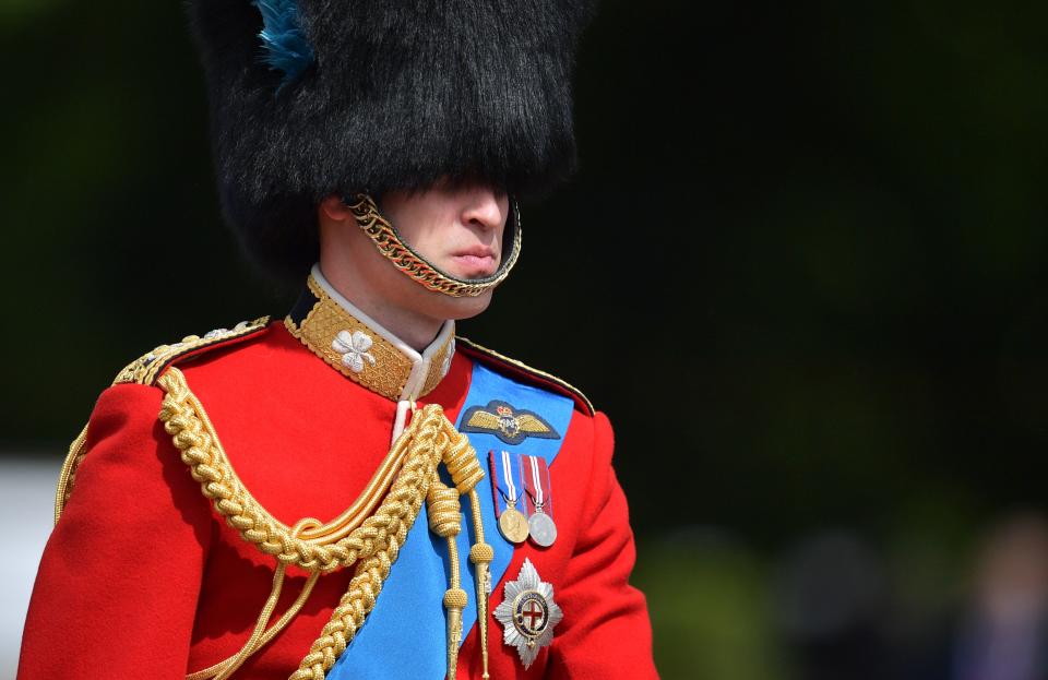 Britain's Prince William, Duke of Cambridge on horseback follows Britain's Queen Elizabeth II in a horse-drawn carriage into Horseguards parade for the Queen's Birthday Parade, 'Trooping the Colour', in London on June 8, 2019. - The ceremony of Trooping the Colour is believed to have first been performed during the reign of King Charles II. Since 1748, the Trooping of the Colour has marked the official birthday of the British Sovereign. Over 1400 parading soldiers, almost 300 horses and 400 musicians take part in the event. (Photo by Daniel LEAL-OLIVAS / AFP)        (Photo credit should read DANIEL LEAL-OLIVAS/AFP/Getty Images)