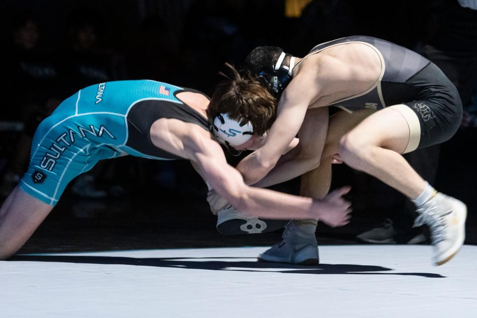 Hesperia's Paulo Valdez, right, takes on Sultana's Rocky Humphrey in a 120-pound match on Thursday, Jan. 11, 2024. Valdez won the match with a 10-4 decision.