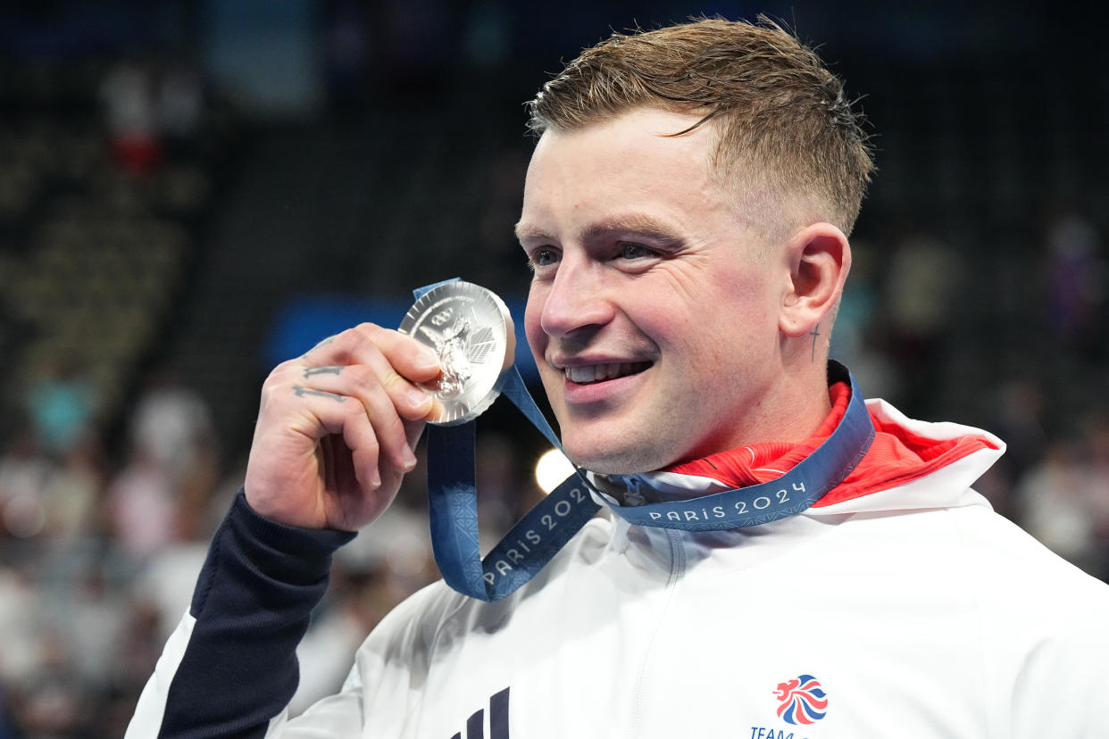 28 July 2024, France, Paris: Olympics, Paris 2024, Swimming, Paris La Defense Arena, 100 m breaststroke, men, final, runner-up Adam Peaty from Great Britain celebrates at the award ceremony. Photo: Michael Kappeler/dpa (Photo by Michael Kappeler/picture alliance via Getty Images)