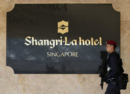 A member of the Special Operations Command patrols outside the venue of the International Institute for Strategic Studies' (IISS) Shangri-La Dialogue in Singapore May 29, 2015. REUTERS/Edgar Su/File Photo