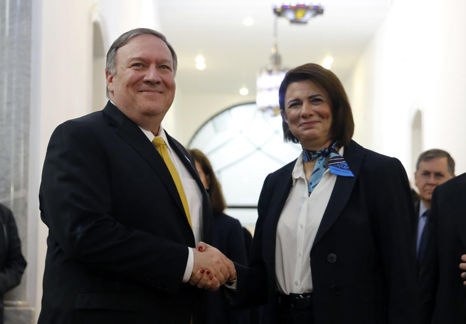 Lebanon Interior Minister Raya El Hassan, right, shakes hands with U.S. Secretary of State Mike Pompeo at the interior ministry in Beirut, Lebanon, Friday, March 22, 2019. Pompeo has arrived in Lebanon, the last leg of a Mideast tour that took him to Kuwait and Israel. (AP Photo/Bilal Hussein)