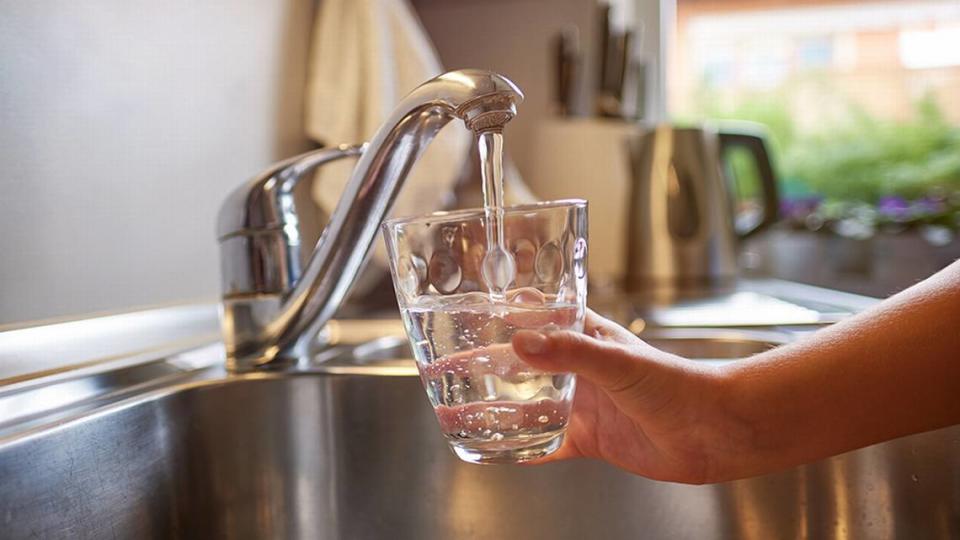 Pouring Fresh Tap Water Into a Glass