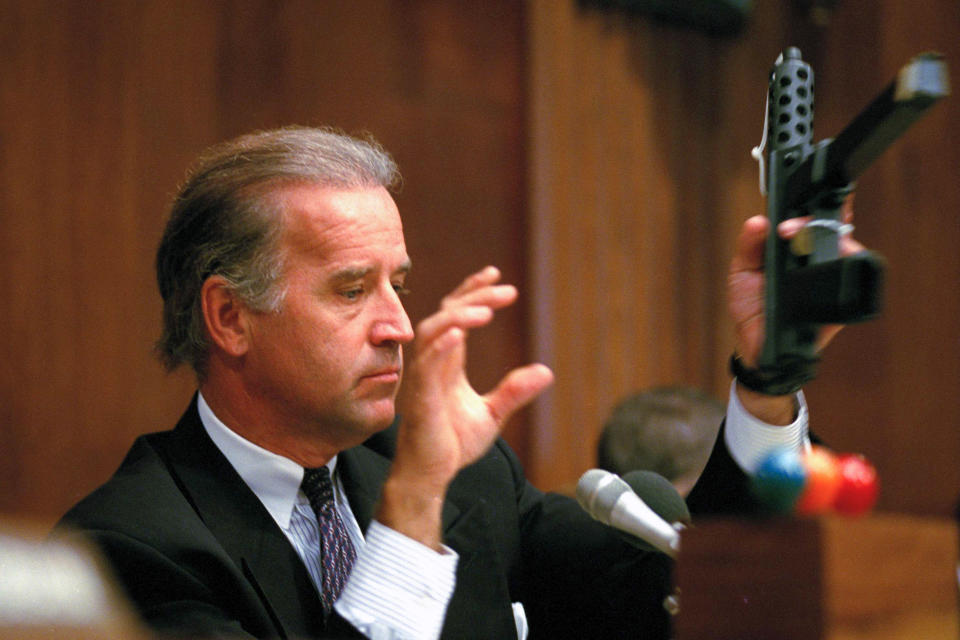 FILE - Sen. Joe Biden, D-Del., chairman of the Senate Judiciary Committee, holds a TEC-9 semi-automatic pistol during a hearing of the committee on Capitol Hill, Aug. 3, 1993, as the committee holds hearings on combating the proliferation of assault weapons. (AP Photo/Barry Thumma, File)