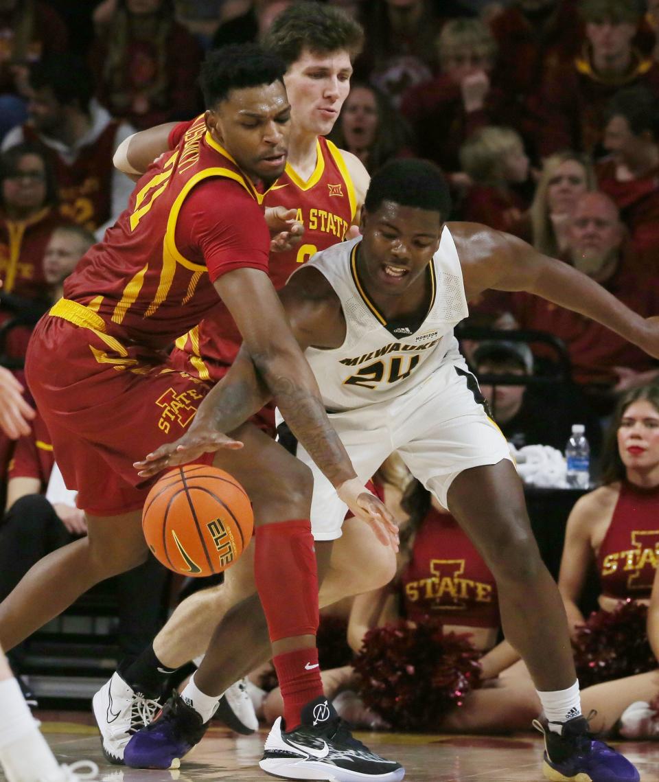 Iowa State center Osun Osunniyi attempts to steal the ball from UWM forward Jaylen Johnson during the second half Sunday night.