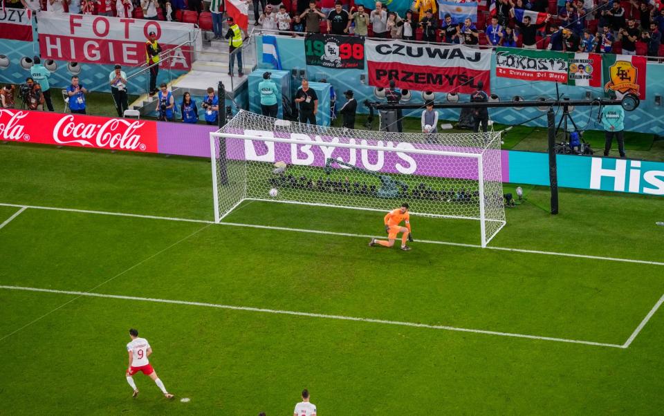 Poland's Robert Lewandowski scores - AP