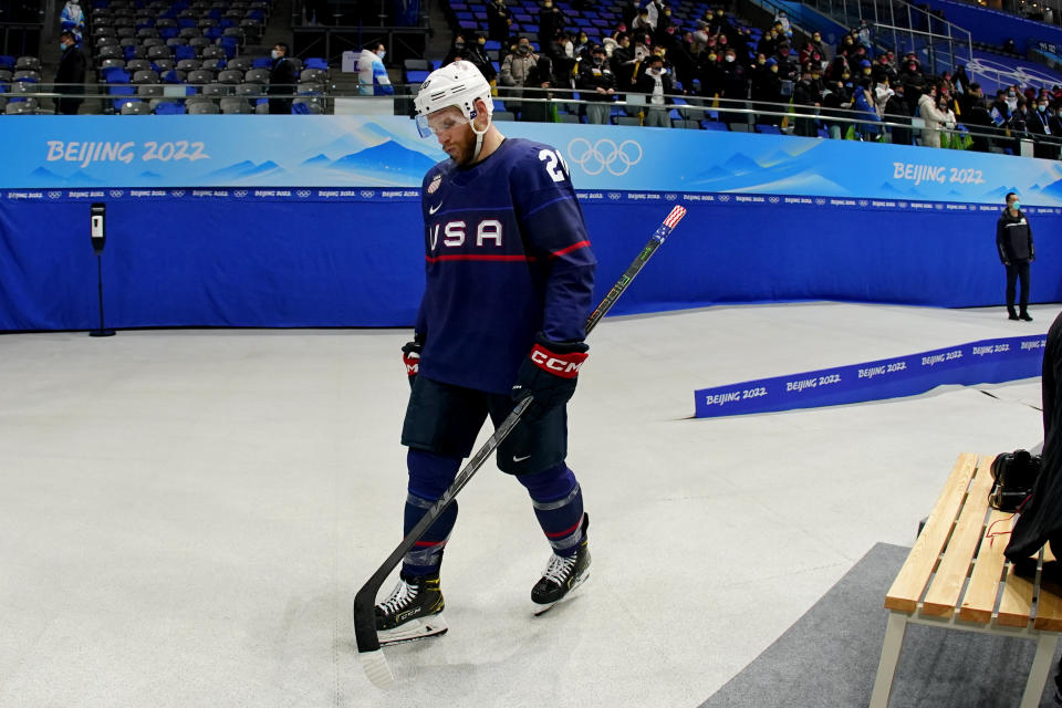 United States' Steven Kampfer leaves the rink after the United States lost to Slovakia in a men's quarterfinal hockey game at the 2022 Winter Olympics, Wednesday, Feb. 16, 2022, in Beijing. Slovakia won 3-2 in a shoot-out. (AP Photo/Matt Slocum)