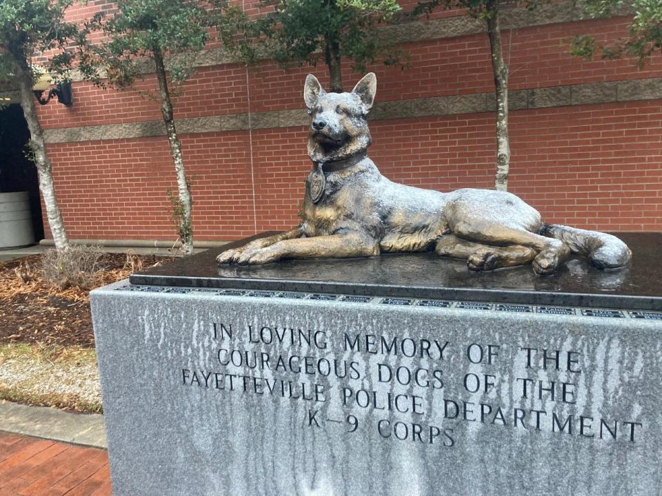 Light snow could be seen early on Jan. 29, 2022 on a statue honoring dogs that served with the Fayetteville Police Department's K-9 Corps.