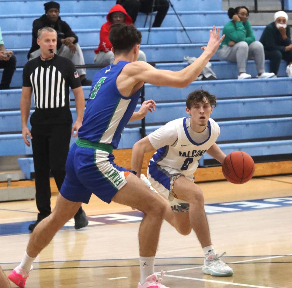 Daytona State's Dylan Diaz (0) works toward the basket as East Florida State's Andrija Bukumirovic defends, Saturday, Jan. 20, 2024.