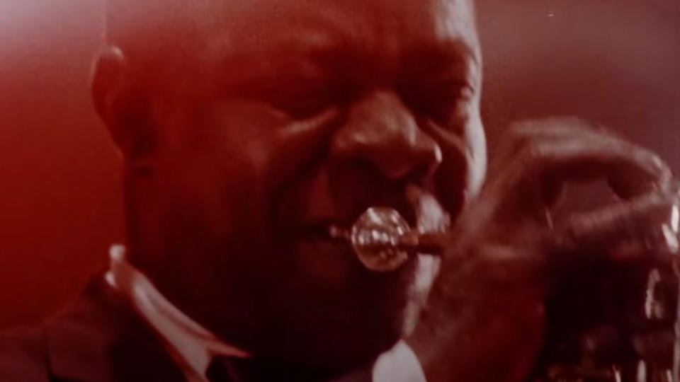 Louis Armstrong playing trumpet