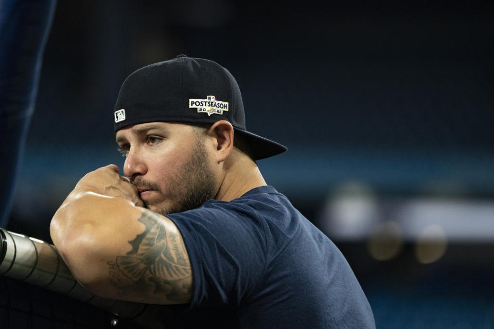 Seattle Mariners infielder Ty France watches from behind the batting cage during a baseball workout, Thursday, Oct. 6, 2022, in Toronto ahead of the team's wildcard playoff game against the Toronto Blue Jays. (Alex Lupul/The Canadian Press via AP)