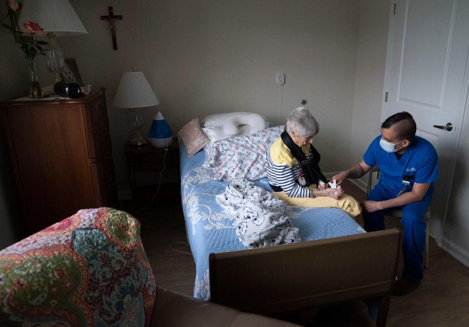 Alive Hospice nurse Marc Vera visits with a patient, Helen Baldwin, at her assisted living facility Monday, April 25, 2022, in Mt. Juliet, Tenn.