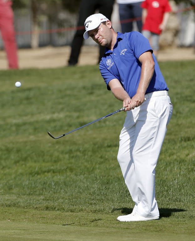 South Africa's Branden Grace takes his shot during the third round of the Abu Dhabi Golf Championship in the Emirati capital, on January 19, 2013. Joburg Open's defending champion Grace took advantage of the bad luck of Charl Schwartzel last year to win the title soon after leaving qualifying school and went on to claim three more titles