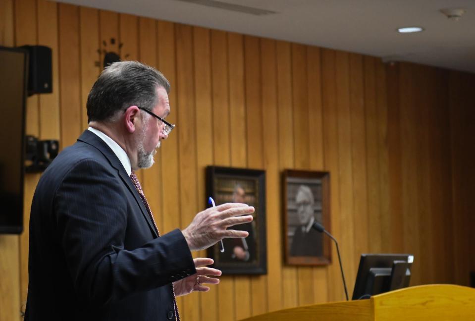 Eaton County Public Defender Timothy Havis cross examines Beverly McCallum in Judge Janice Cunningham's courtroom in Eaton County, Friday, March 29, 2024. McCallum was extradited from Italy after former husband Roberto Caraballo's burnt remains were found on a Michigan farm in 2015. She was found guilty for her role in the 20 year old cold case murder.