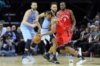 Nov 27, 2018; Memphis, TN, USA; Toronto Raptors forward Kawhi Leonard (2) drives against Memphis Grizzlies forward Kyle Anderson (1) as Grizzlies center Marc Gasol (33) and Raptors forward Serge Ibaka (9) look on at FedExForum. Toronto won 122-114. Mandatory Credit: Nelson Chenault-USA TODAY Sports