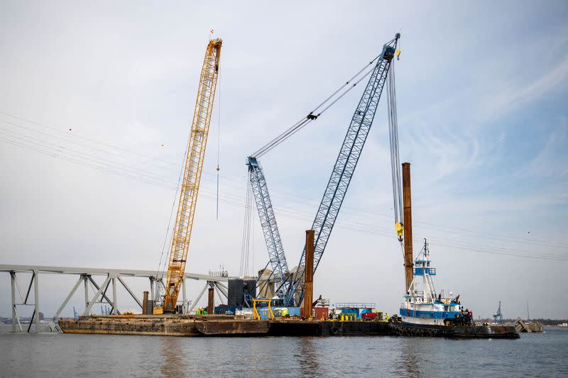 FILE PHOTO: Barge cranes are shown near the collapsed Francis Scott Key Bridge in Baltimore