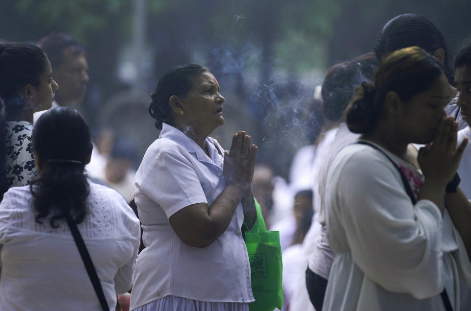 Sri Lankan Buddhist devotees pray at a temple on the day of Buddha Poornima, or Vesak in Colombo, Sri Lanka, Thursday, May 23, 2023. (AP Photo/Eranga Jayawardena)