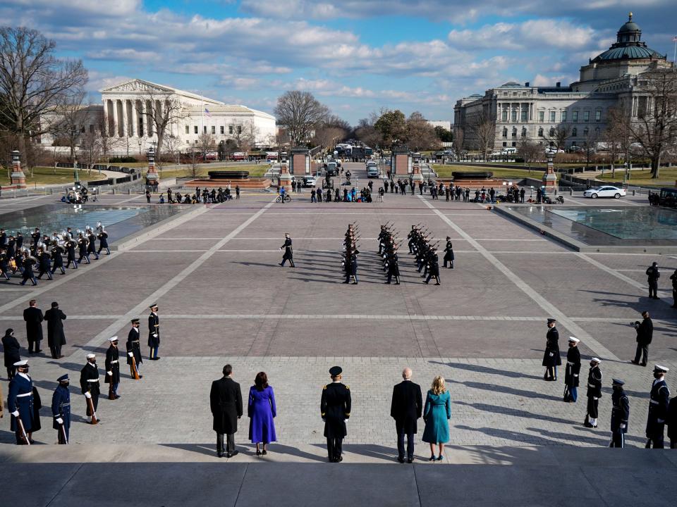 Joe Biden, Jill Biden, Kamala Harris, and Doug Emhoff depart the East Front of the Capitol at the conclusion of the inauguration ceremonies for the Pass in Review with members of the militaryAP