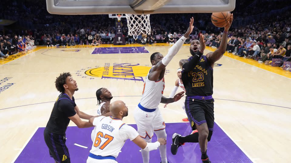 LeBron James shoots the ball against New York Knicks forward Julius Randle in the first half at Crypto.com Arena. - Kirby Lee/USA TODAY Sports/Reuters