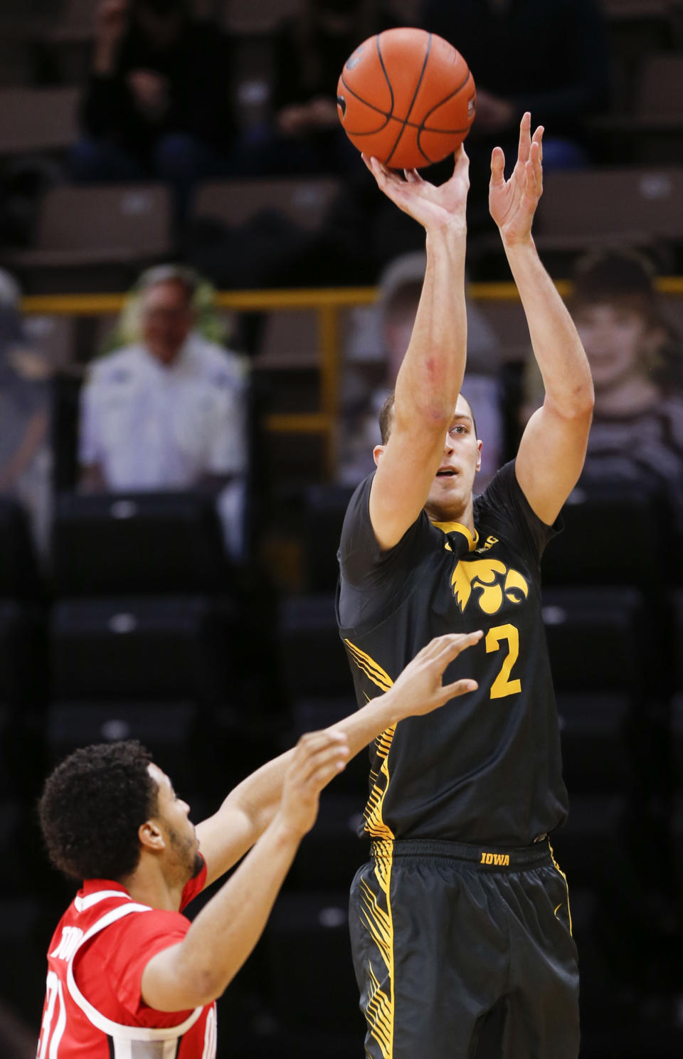 Iowa forward Jack Nunge (2) shoots a three-point basket against Ohio State in the first half of an NCAA college basketball game in Iowa City, Iowa, Thursday, Feb. 4, 2021. (Rebecca F. Miller/The Gazette via AP)