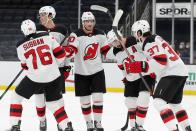 New Jersey Devils' Pavel Zacha (37) celebrates his goal with teammates, from left, P.K. Subban, Mikhail Maltsev, Dmitry Kulikov and Kyle Palmieri during the third period of an NHL hockey game against the Boston Bruins, Sunday, March 7, 2021, in Boston. (AP Photo/Michael Dwyer)