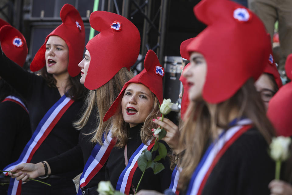 Conservative activists gather to protest in Paris, Sunday Oct. 6, 2019, against a French bill that would give lesbian couples and single women access to in vitro fertilization and related procedures. Traditional Catholic groups and far-right activists organized Sunday's protest, arguing that it deprives children of the right to a father. (AP Photo/Rafael Yaghobzadeh)