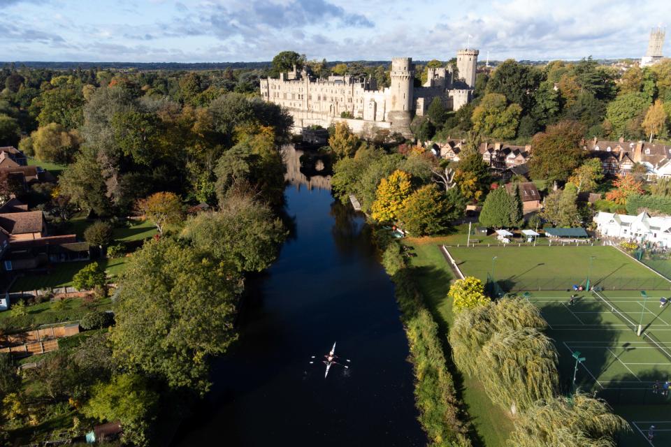 Rowers approach Warwick Castle as they travel along the River Avon. There were more than 3,000 large-scale sewage dumps into England's rivers and seas last year, up 63% from the year before. (PA)