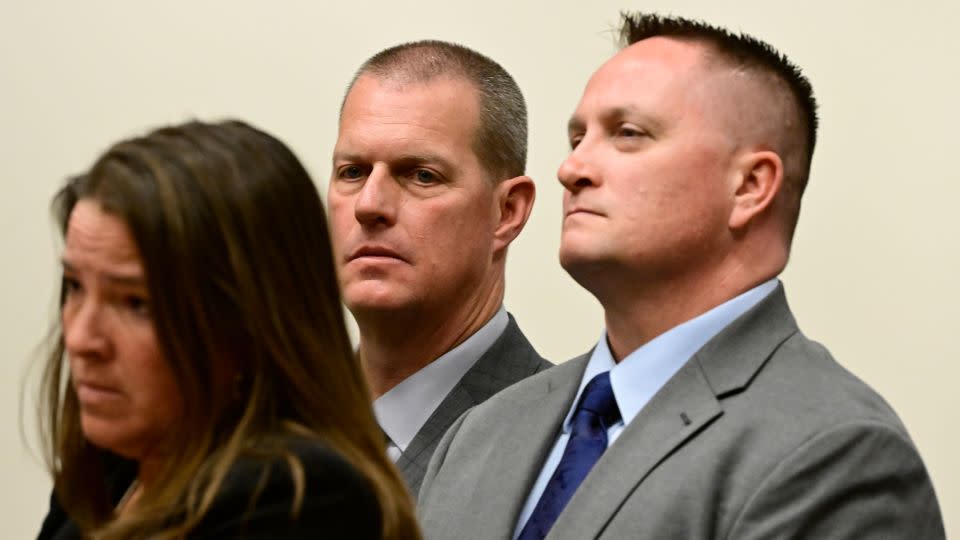 Paramedics Peter Cichuniec, center, and Jeremy Cooper, right, listen to attorney Shana Beggan at an arraignment in the Adams County district court at the Adams County Justice Center January 20, 2023. - Andy Cross/MediaNews Group/The Denver Post/Getty Images