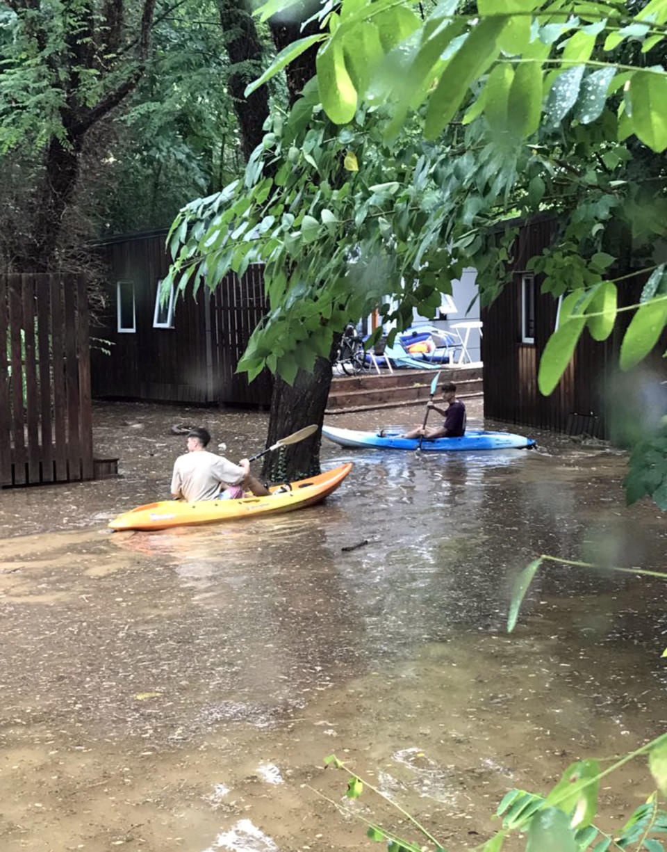 <em>Canoes – Ms Alford took pictures of people in canoes at the flooded campsite (Picture: PA)</em>