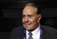 FILE - Former Republican presidential candidate Sen. Bob Dole arrives at the Quicken Loans Arena before the evening session of the opening day of the Republican National Convention in Cleveland, Monday, July 18, 2016. Bob Dole, who overcame disabling war wounds to become a sharp-tongued Senate leader from Kansas, a Republican presidential candidate and then a symbol and celebrant of his dwindling generation of World War II veterans, has died. He was 98. His wife, Elizabeth Dole, posted the announcement Sunday, Dec. 5, 2021, on Twitter. (AP Photo/Carolyn Kaster, File)