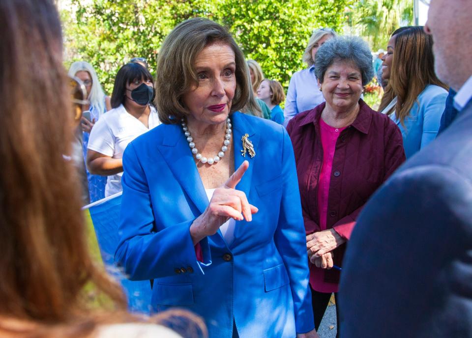 U.S. Speaker of the House speaks to members of the audience Saturday in Delray Beach. At her right is U.S. Rep. Lois Frankel, D-West Palm Beach.