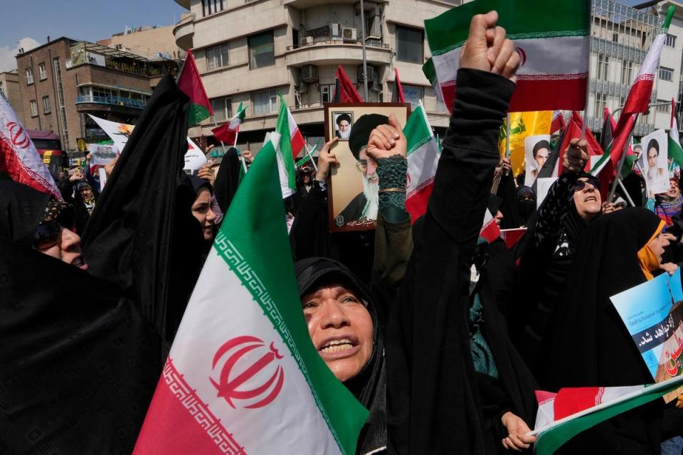 Iranian worshippers in Tehran on Friday (AP)