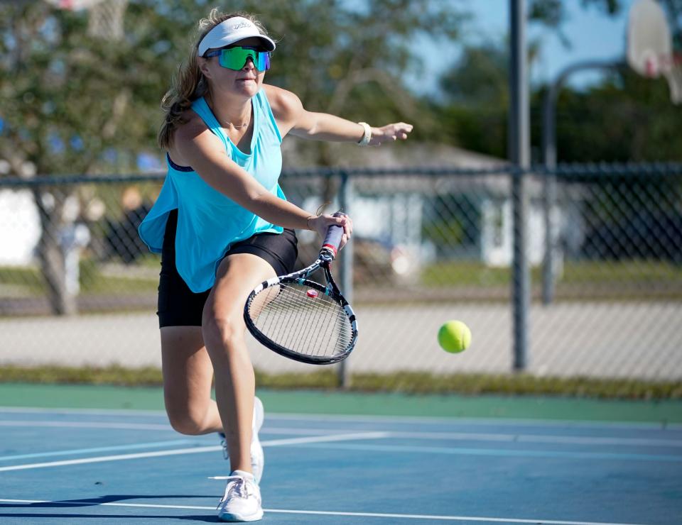 Mary Jo Ellis tracks a ball during a tennis clinic at Burton Memorial Park.