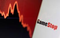 FILE PHOTO: GameStop logo is seen near displayed stock graph in this illustration