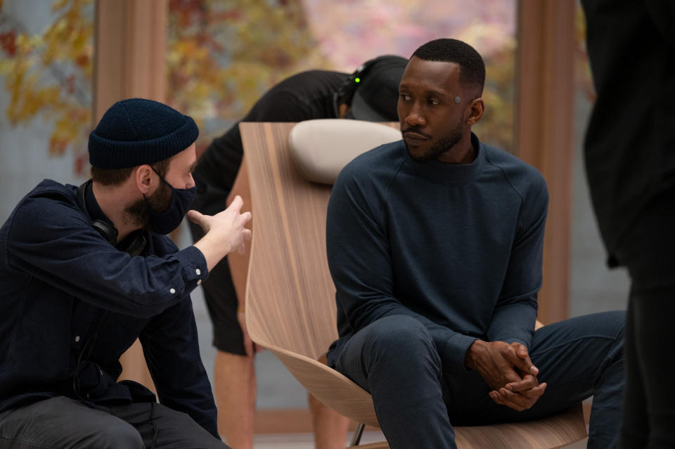 Director Benjamin Cleary and Mahershala Ali behind the scenes of “Swan Song,” premiering globally on Apple TV+ on December 17, 2021.
