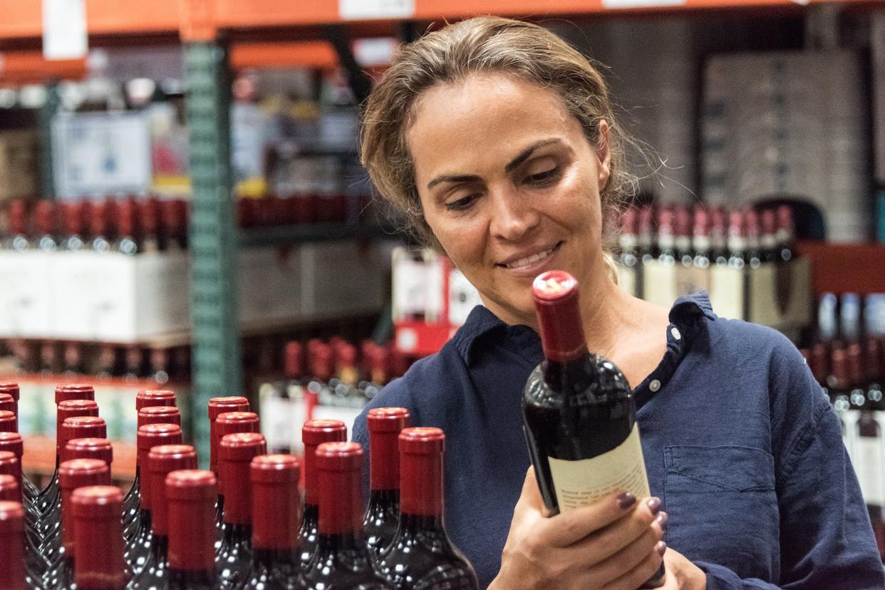 woman shopping for wine in winery store