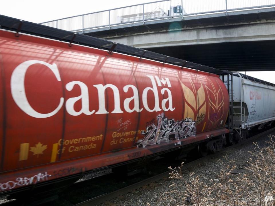  A Canadian Pacific Rail train hauling grain passes through Calgary.