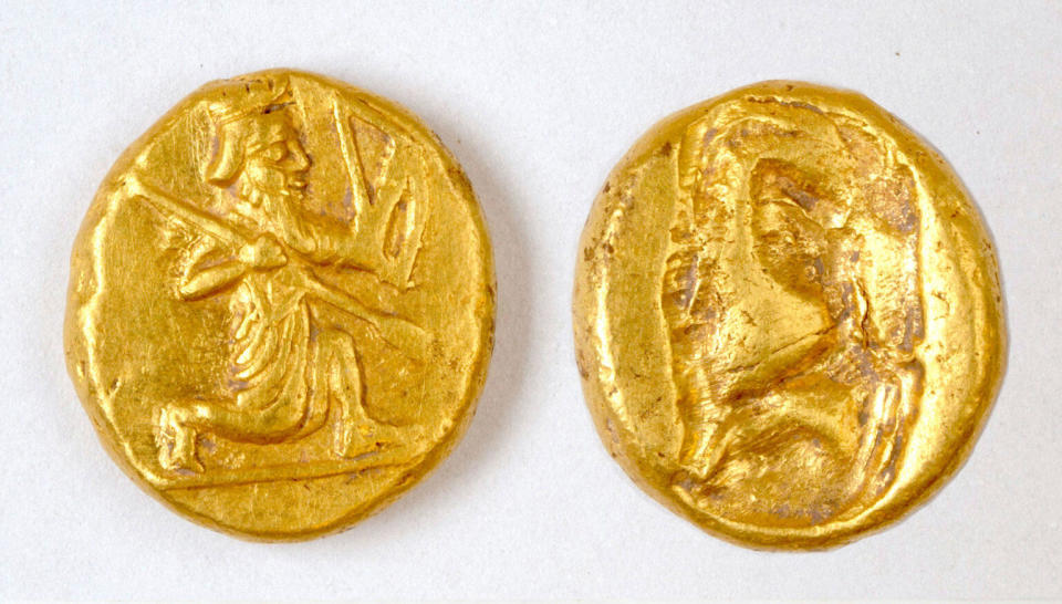 The coins discovered by the researchers feature the figure of a kneeling archer, a characteristic design of the Persian Daric.  / Credit: Notion Archaeological Project, University of Michigan