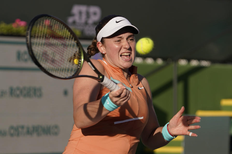 Jelena Ostapenko, of Latvia, returns a shot to Shelby Rogers at the BNP Paribas Open tennis tournament Saturday, March 12, 2022, in Indian Wells, Calif. (AP Photo/Mark J. Terrill)