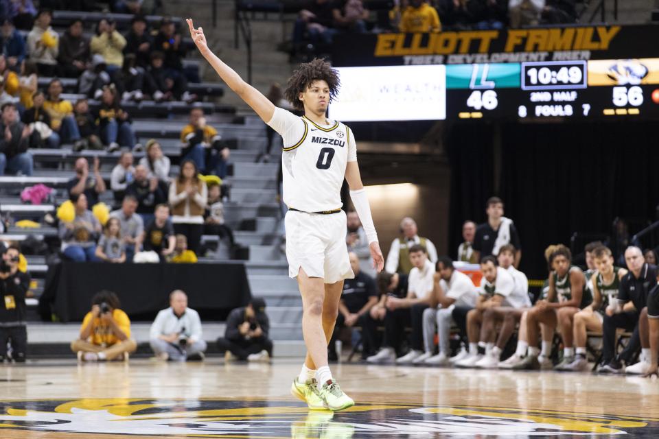 Missouri's Jordan Butler celebrates a three point shot during the second half of an NCAA college basketball game against Loyola Md Saturday, Nov. 25, 2023, in Columbia, Mo. Missouri won 78-70. (AP Photo/L.G. Patterson)