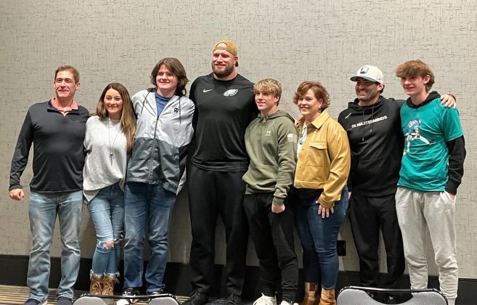 Philadelphia Eagles offensive lineman Lane Johnson (wearing backwards ball cap) met Sunday with three KC-area Gold Star families. He listened to and encouraged the family members and presented them with tickets to an NFL game.