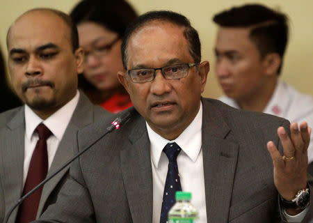 John Gomes (R), Bangladesh's ambassador to the Philippines, gestures during a money laundering hearing at a hotel in metro Manila, Philippines May 19, 2016. At left is Probash Lamarong, Second Secretary and Head of the Bangladesh Embassy in Manila. REUTERS/Czar Dancel