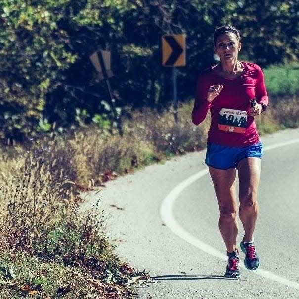 Bryna Edwards running a race on the side of the road