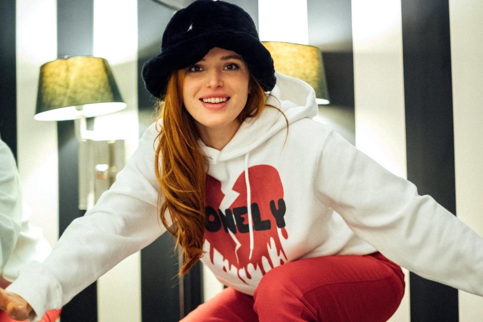 Actress-singer Bella Thorne wears a hoodie from her Lonely merchandise collection.