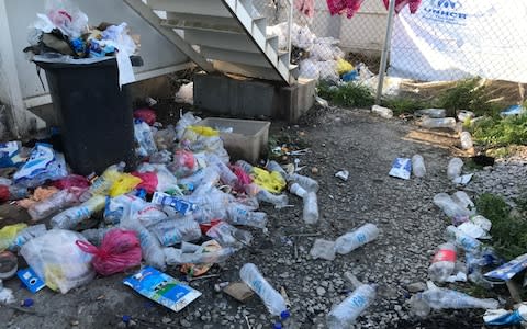 Bins overflow with rubbish and rotting food in Moria refugee camp, Lesbos. - Credit: Nick Squires