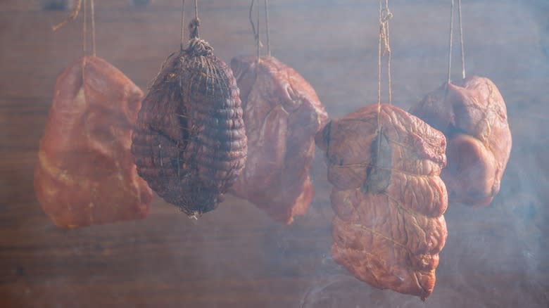 Hams hanging in a smokehouse