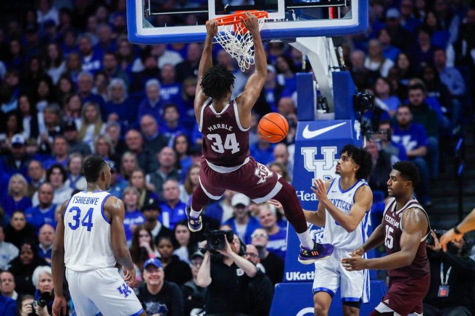 Texas A&M forward Julius Marble (34) dunked during the Aggies’ 76-67 loss to Kentucky at Rupp Arena last season.