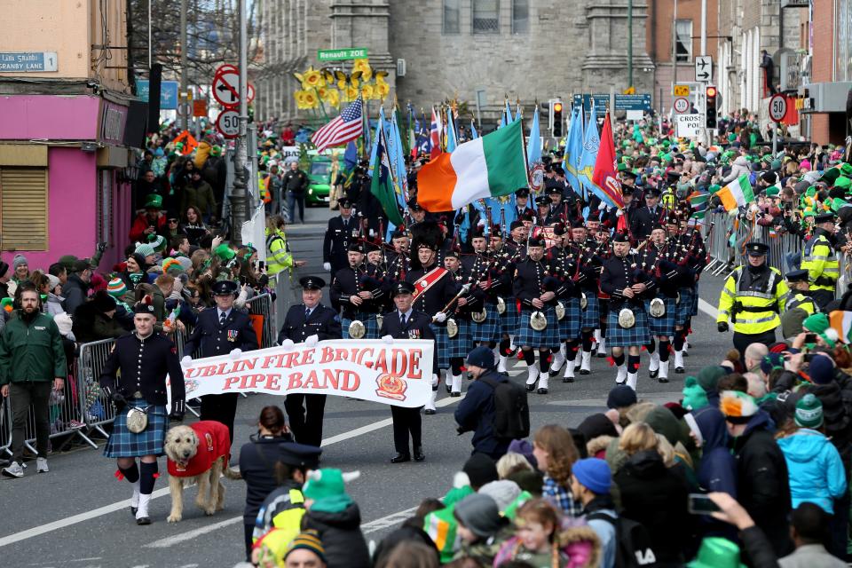 Crowds line the route during the annual St Patricks Day parade through the city centre of Dublin on March 17, 2019. (Photo by Paul FAITH / AFP)        (Photo credit should read PAUL FAITH/AFP via Getty Images)