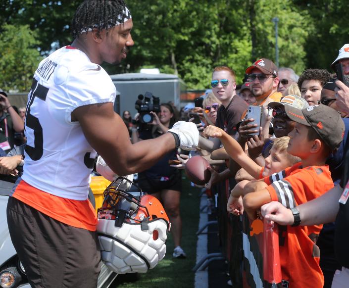 Cleveland Browns defensive end Myles Garrett fist bumps a fan during training camp on Saturday, July 30, 2022 in Berea.
