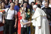 Pope Francis greets participants at the Italian International Circus festival, during his weekly general audience, in St.Peter's Square, at the Vatican, Wednesday, Oct. 16, 2019. (AP Photo/Andrew Medichini)